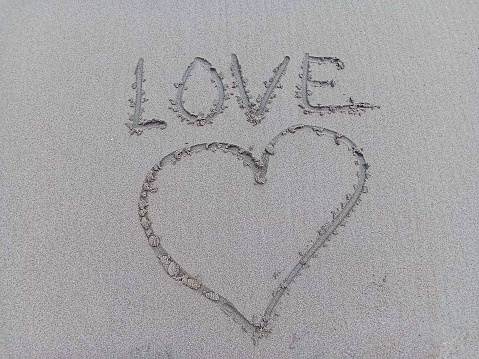 A symbol of love written in the sand