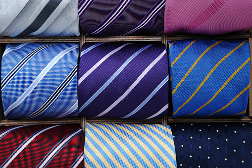 Background of colorful neckties in basket