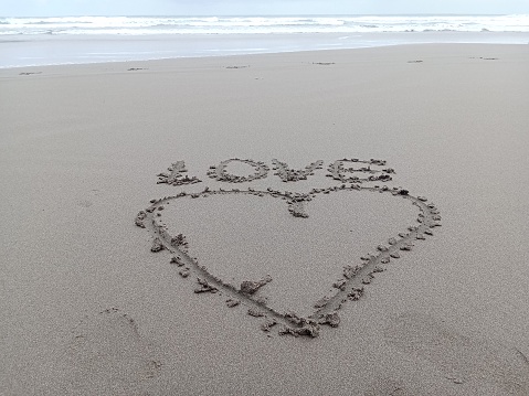 A symbol of love written in the sand