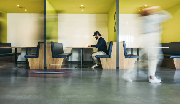 istock Focused business professional working in a busy office coworking office 2066413461