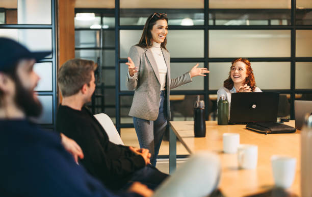 istock Successful project discussion: Young business woman leads a creative brainstorm for a new project 2066417013