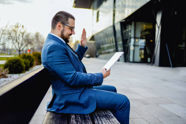 istock Businessman having a video call outdoors 2066447480