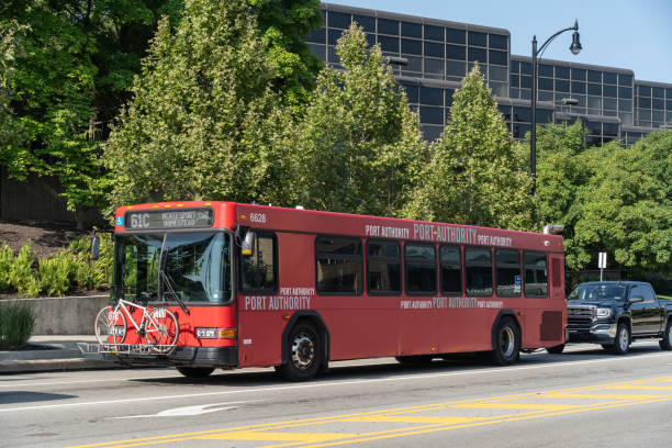 Pittsburgh, Pennsylvania  July 23,2023:  A Port Autority red city bus with bicycle on Forbes Ave. in Pittsburgh, Pa.