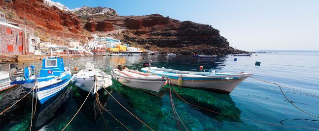 Amoudi bay with boats, port of Oia, Santorini Greece at sunny summer, web banner