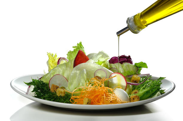 Salad plate with olive oil falling
