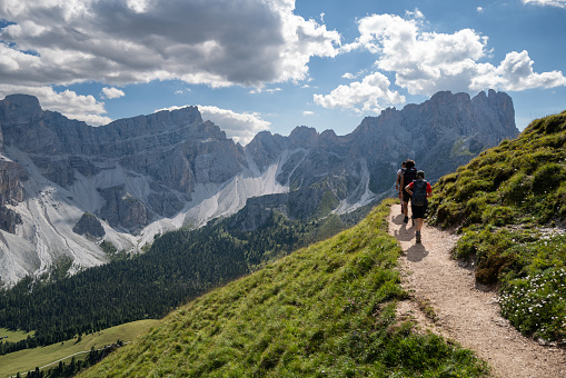 Friends hiking on the Dolomites: outdoor adventures