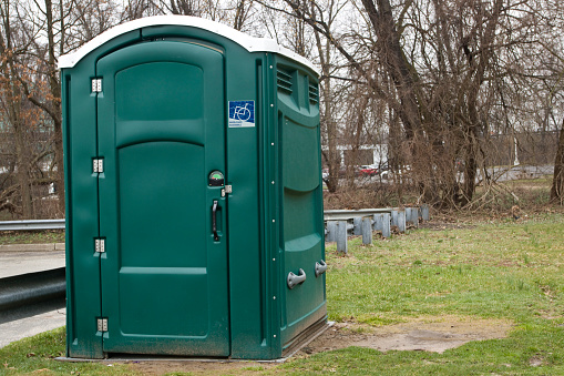 Portable oversized Toilet handicapped accessible in a public Park.