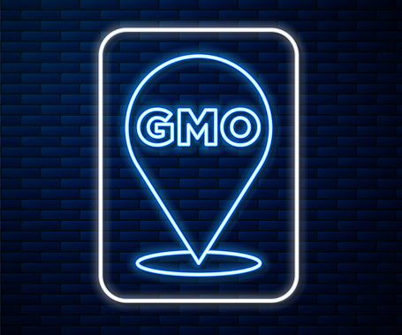 Glowing neon line GMO icon isolated on brick wall background. Genetically modified organism acronym. Dna food modification. Vector.