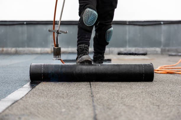istock professional roofer applying bitumen roll on flat roof with a gas burner at a modern construction site 2066589989