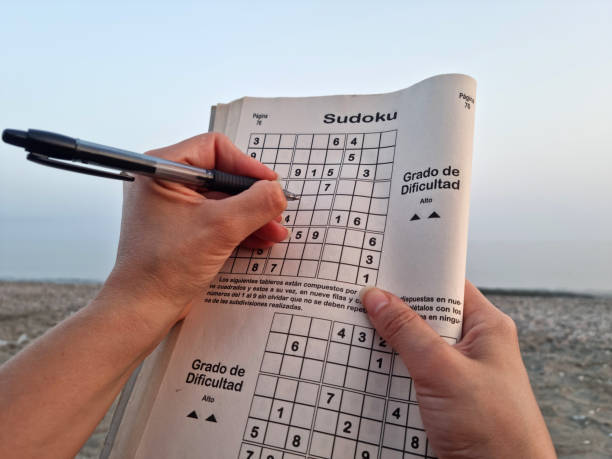 Relaxation concept a person doing sudoku