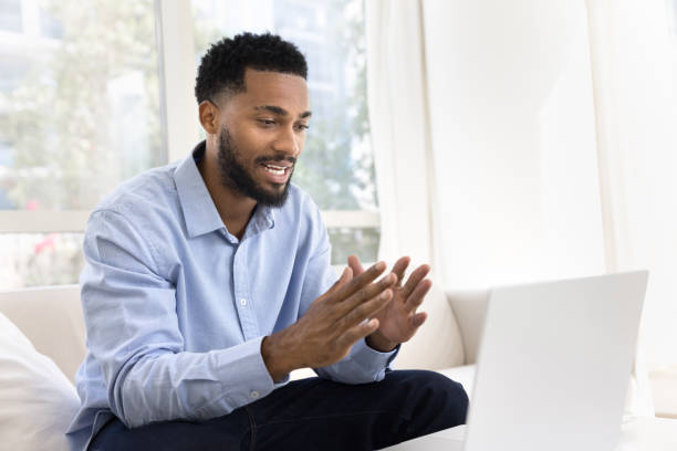 istock Positive young African business man talking on work video call 2066626202