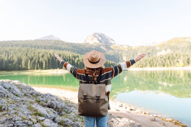 istock Young woman enjoy mountains and lake. 2066628849