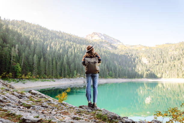 istock Young woman enjoy mountains and lake. 2066629376