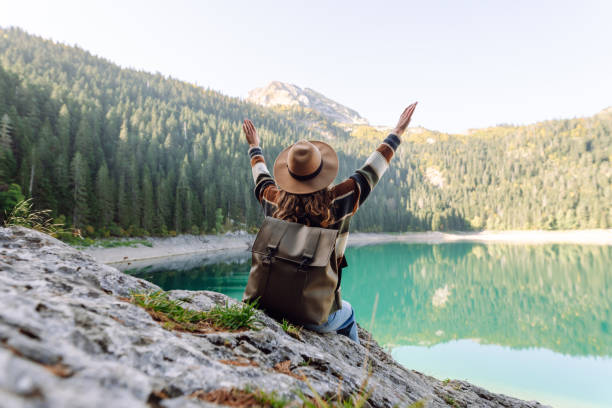 istock Young woman enjoy mountains and lake. 2066629388