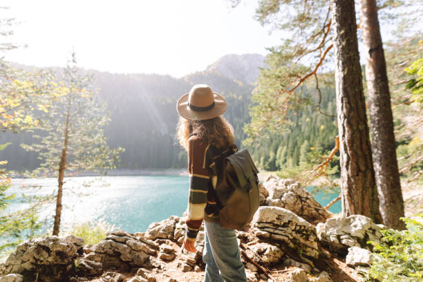 istock Young woman enjoy mountains and lake. 2066629899