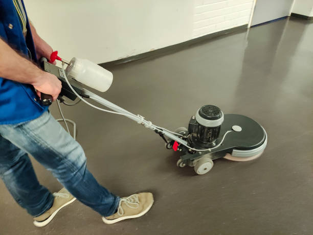 istock A man, a worker, operates a high-speed floor care machine. Applies a protective polymer layer. 2066646368