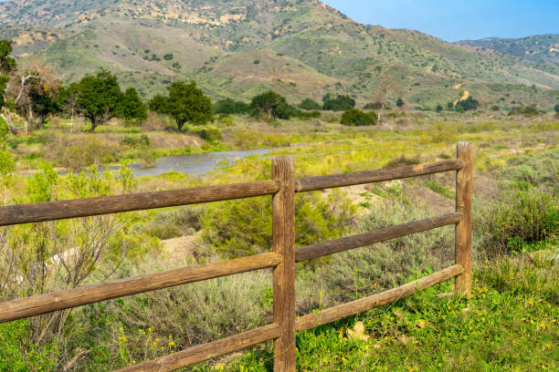 a wooden corral fence with a landscape of irvine regional park in orange county, california - county california orange mt irvine imagens e fotografias de stock