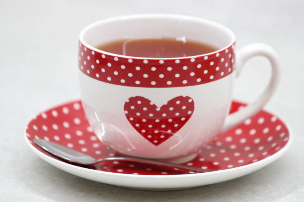 close up woman drinking hot tea