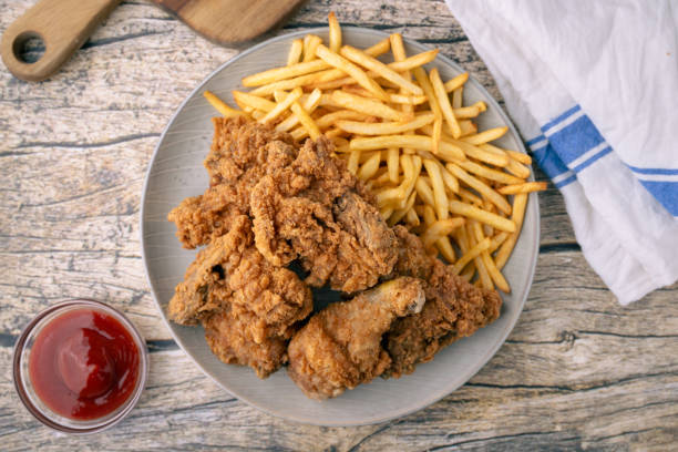 istock fried chicken with french fries 2066684003