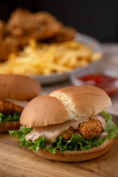istock fried chicken, chicken sandwich and fries 2066688215
