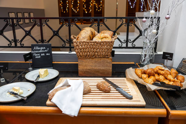Assorted Freshly Baked Bread and Pastries on Display at a Cozy Hotel Buffet