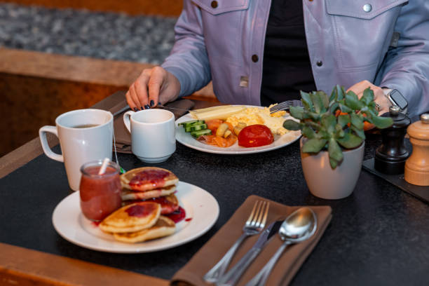 istock Relaxed Hotel Guest Savoring a Delicious Breakfast Spread 2066689318