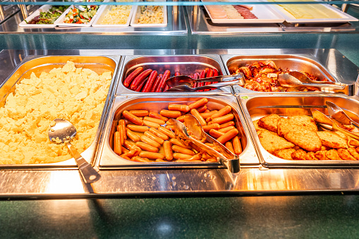 Hot Breakfast Selection with Scrambled Eggs and Sausages at Buffet