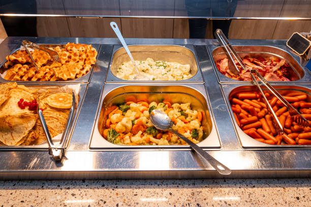 istock Hot Buffet Counter with Assorted Breakfast Foods and Sides in hotel 2066704524