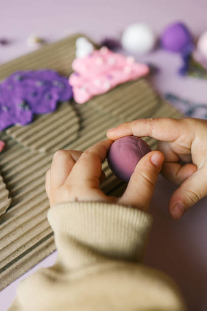 a child sculpts from plasticine, an idea for an activity - school classroom child back to school stock-fotos und bilder