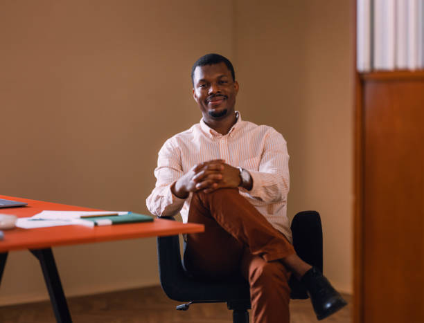 istock Confident Businessman Sitting at Desk in a Modern Office Setting 2066722648