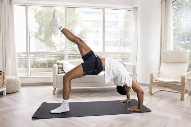 istock Strong athletic young African man doing bridge stand 2066744200