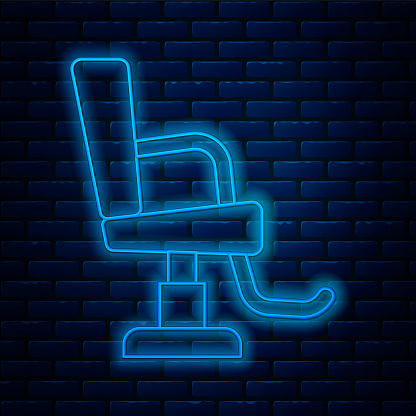 Glowing neon line Barbershop chair icon isolated on brick wall background. Barber armchair sign. Vector.