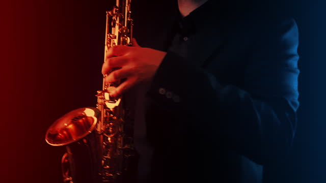 Saxophonist Plays In Stage Lights