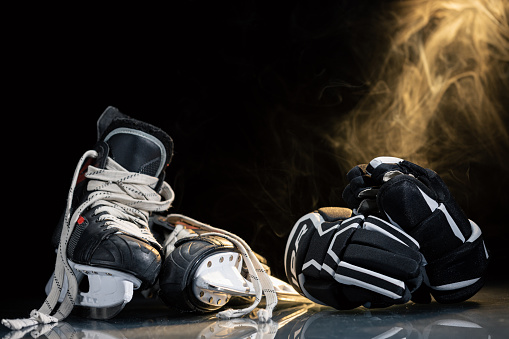 Hockey gear on the ice rink.