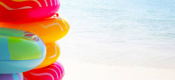 istock Inflatable rings on the beach. Summer concept 2066839695
