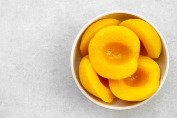 istock Peach halves in syrup. Fruity desserts 2066860944