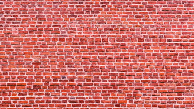 Video of empty red brick wall. Camera moving along background of red brick wall. Wall video for banner or social media ad. Stone texture. Pattern