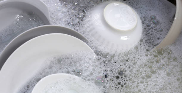 istock Dish washing, Dirty dishes soaking in kitchen sink. 2066867432