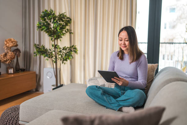 istock Mature Asian Woman Using Tablet at Home 2066872975