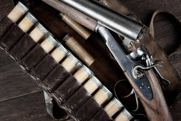 istock 12 gauge break action smooth bored double barreled side shotgun with cases. 2066875190