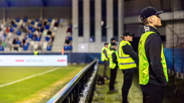 istock Security Team Supervising Football Match at Night 2066875736