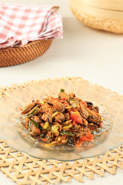 istock Stir Fry Oyster with Chilli, Garlic, Red Onion, and Lime Leaf. 2066877994