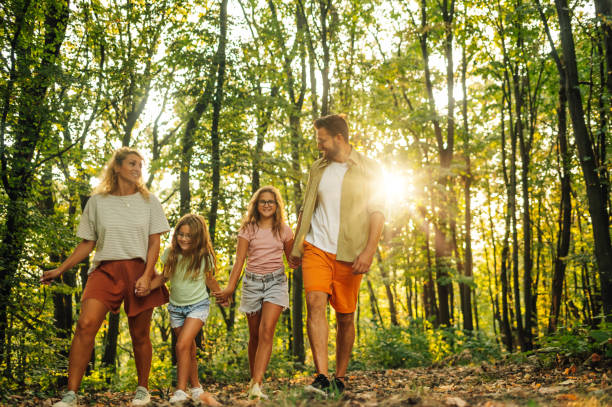 istock A happy family is spending day hiking in forest. 2066880777