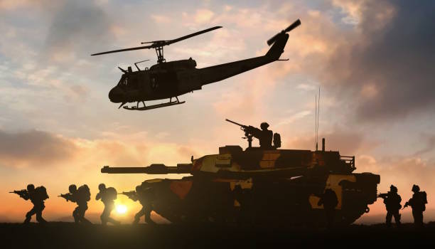istock Military operation with helicopter and tank support 2066932757