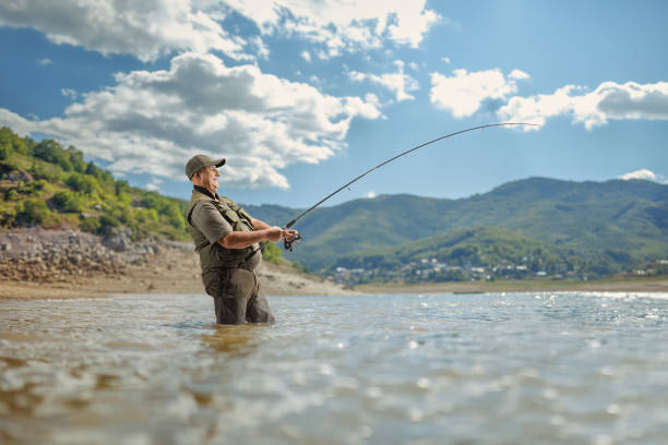 istock Fisherman fishing on a lake 2067026021