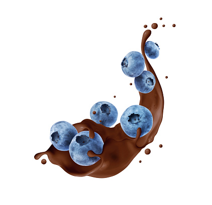 Blueberries in chocolate splashes isolated on a white background