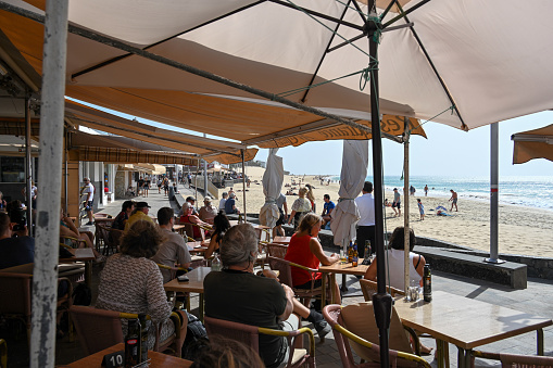 Morro Jable, Fuerteventura, Spain, February 18, 2024 - Beachside cafe on the town beach of Morro Jable, the Playa de la Cebada / Playa del Matorral, Fuerteventura.
