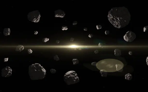 Photo of Asteroids in deep outer space and sun.