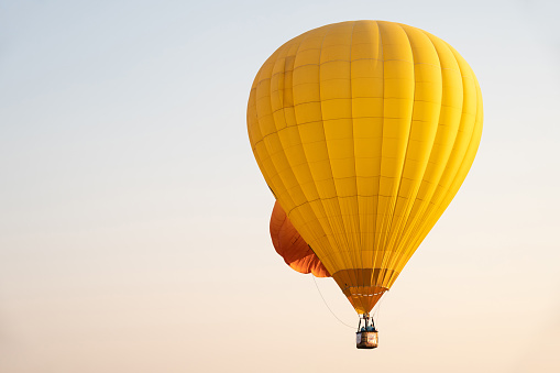 Hot air balloons are aircraft that gain their lift by heating a large contained envelope of air above the ambient temperature.