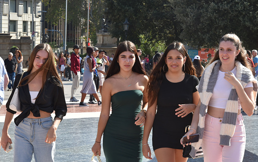 Barcelona, Catalonia- Spain- 10-17-2023: A group of attractive young ladies head towards Las Ramblas in Barcelona.
